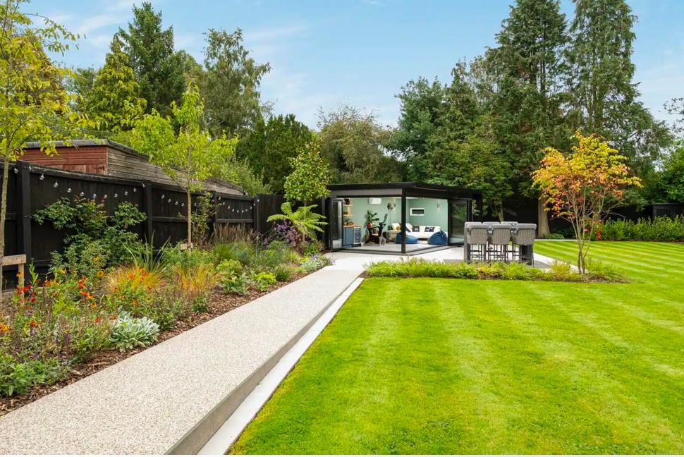 Pristine striped lawn after mowing and aeration in South Surrey